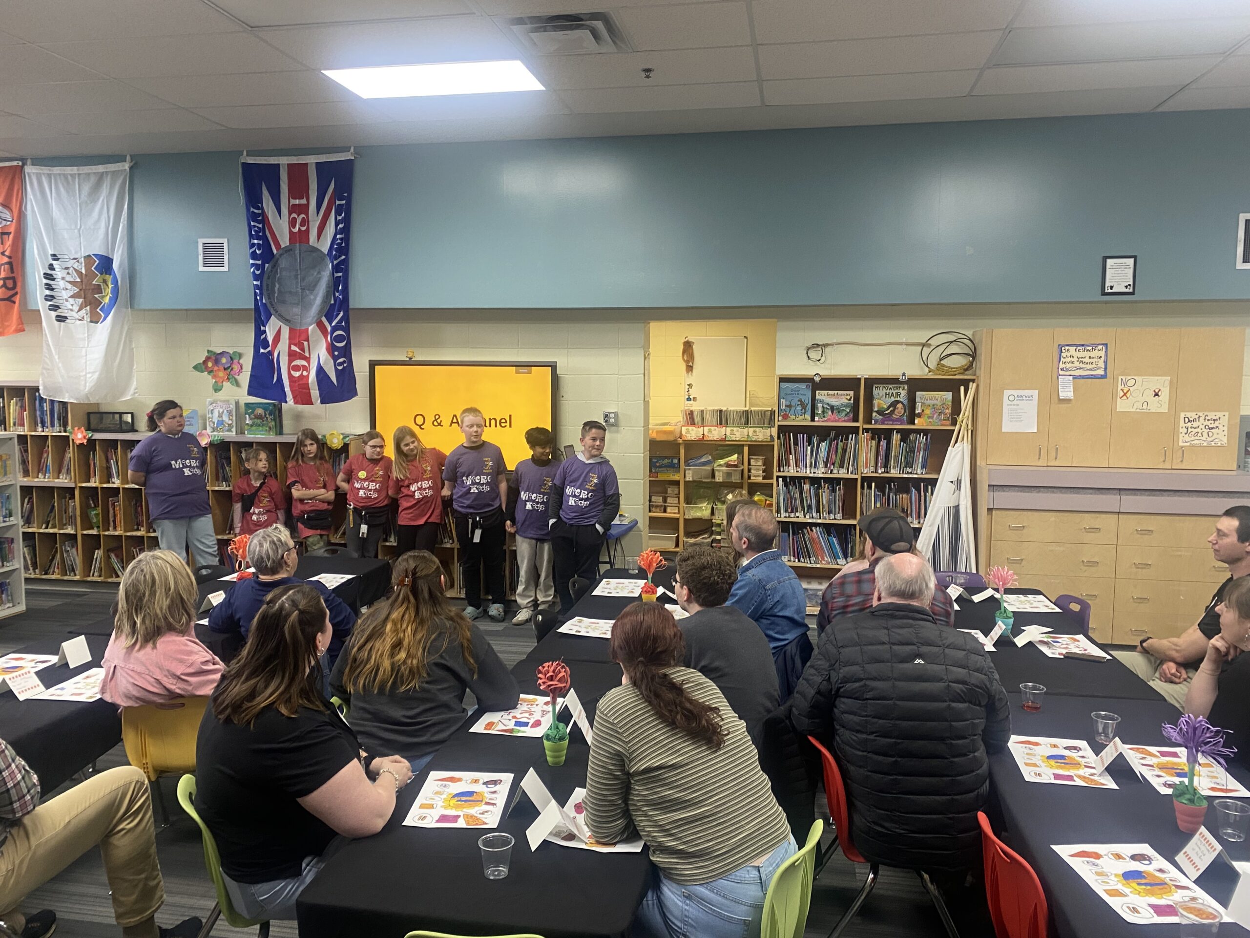 Students of the Aspen Heights MicroSociety answer questions during community partner day